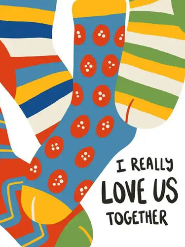 Colorful mismatched socks with stripes and polka dots alongside text saying ’I really love us together’